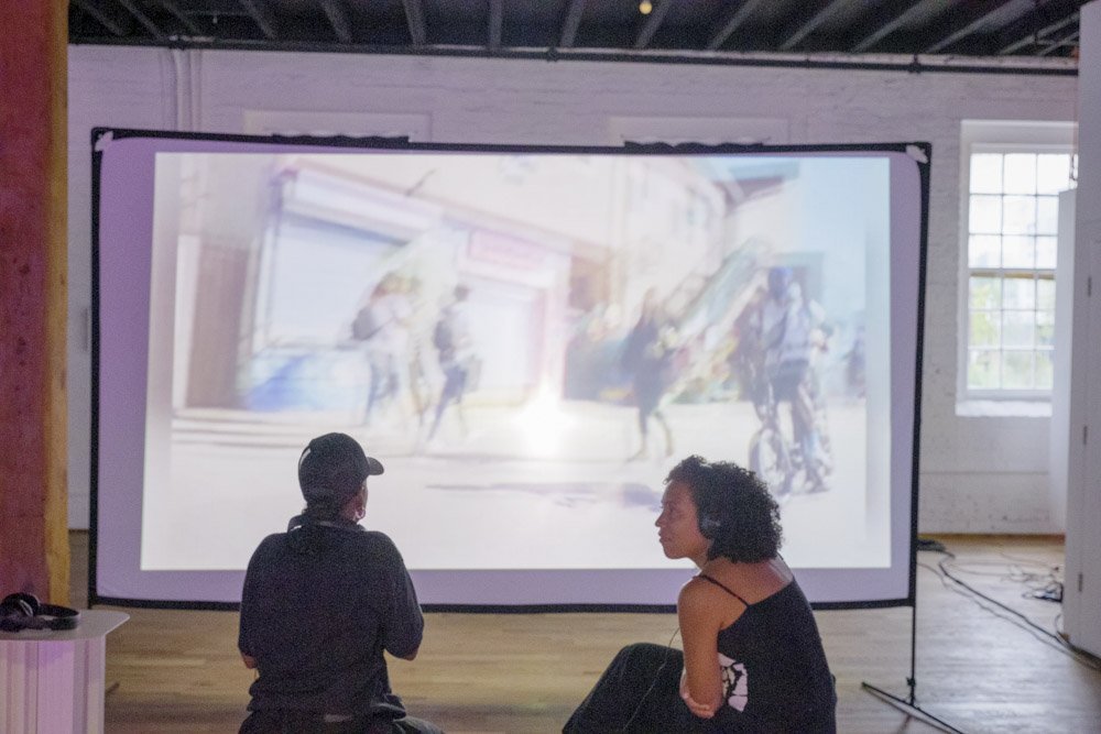 AVC Fest installation: closeup of the screen and glass inside the wooden cabinet