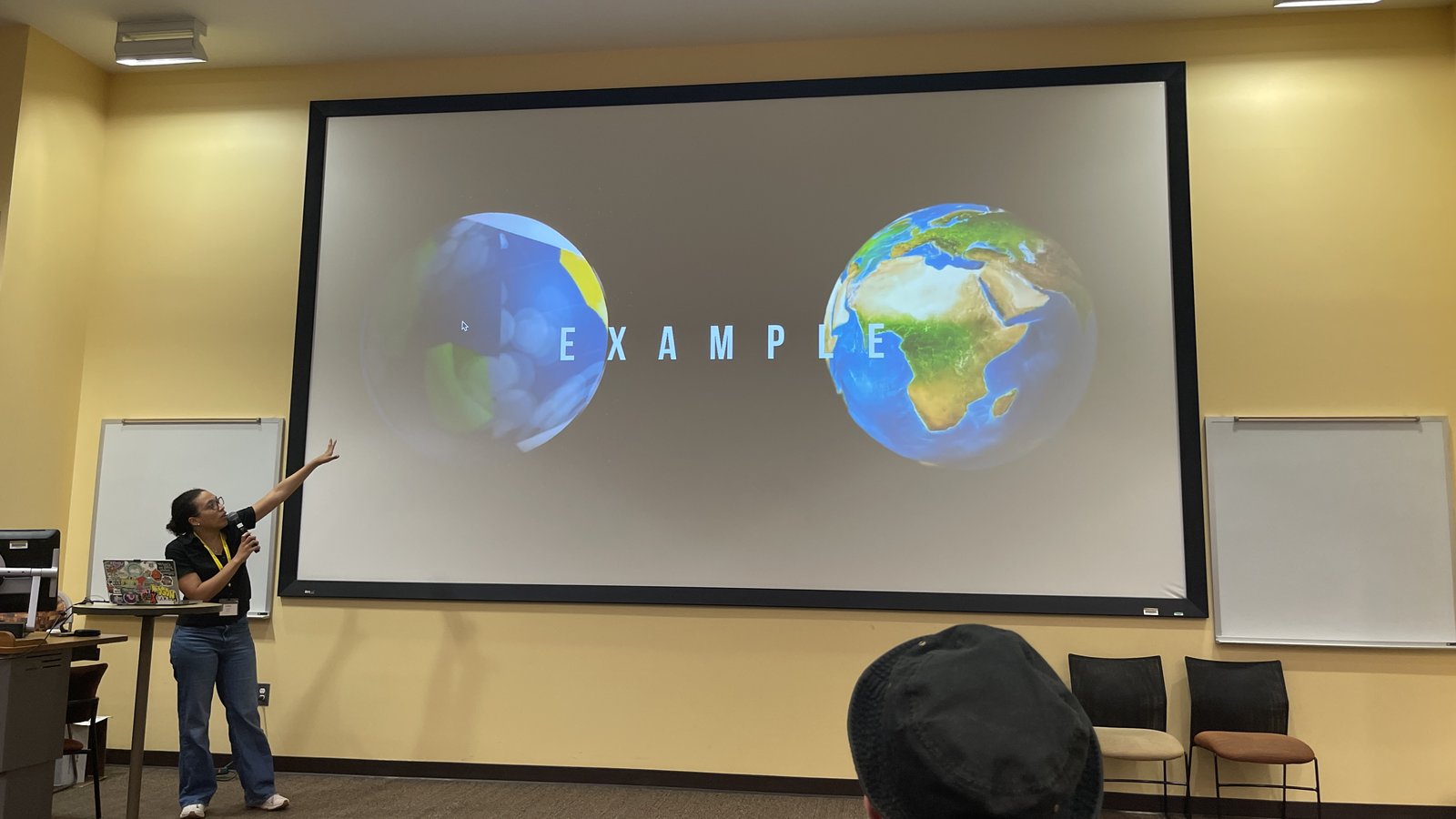 A Code to Visuals workshop session, the instructor walking through a coded 3D scene on screen.